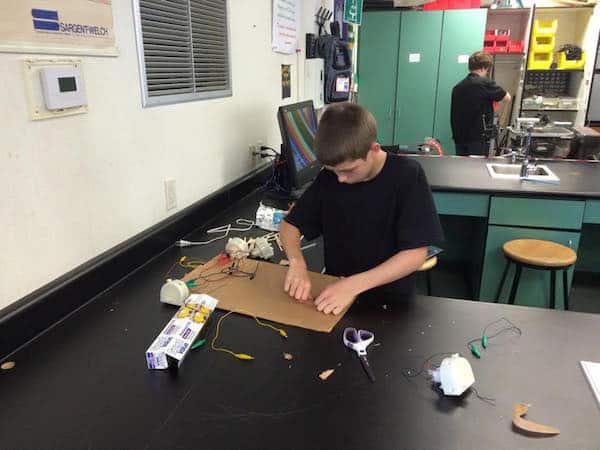 Student Ethan Foerder works diligently to design his prototype on helping robots integrate into society.