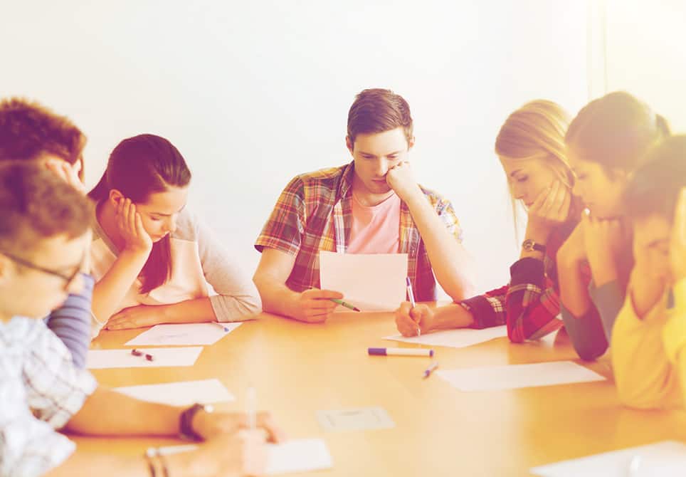 Students thinking sitting Around a table