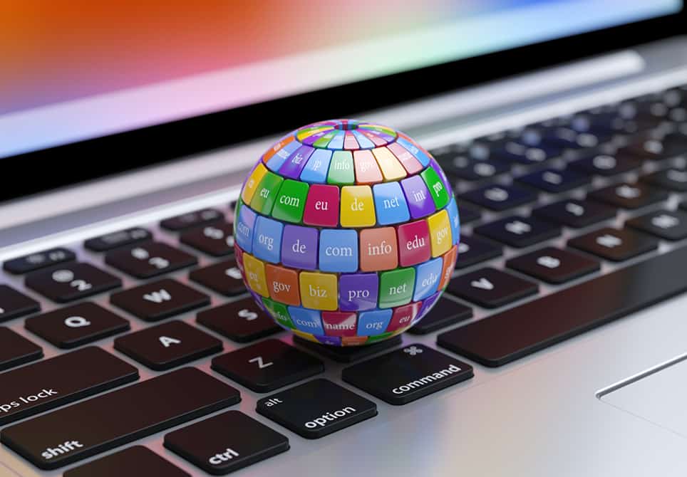 Globe with domain names on keyboard