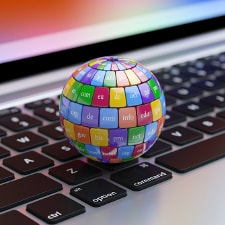 Globe with domain names on keyboard