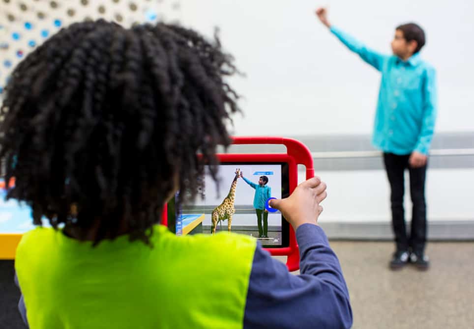 Child using augmented reality app