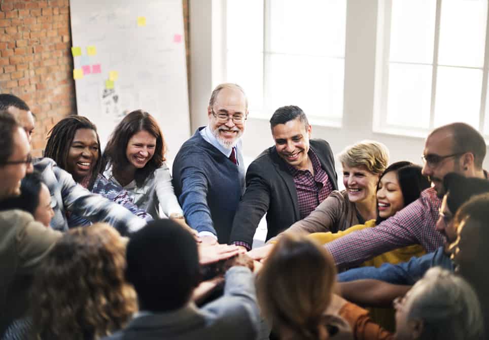 Teachers congratulating each other after professional development exercise