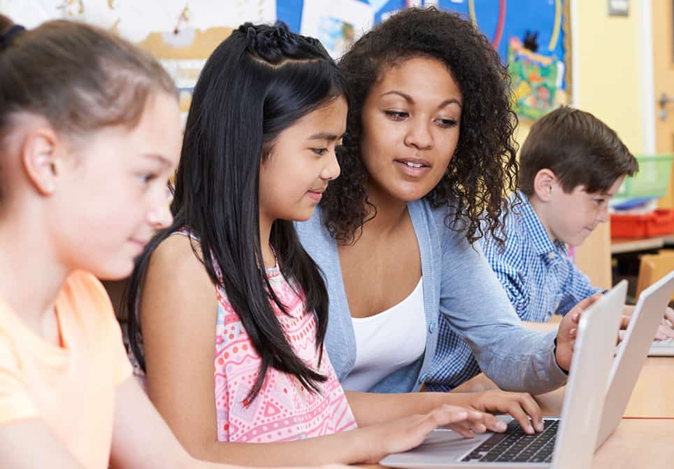 teacher and student and on laptop