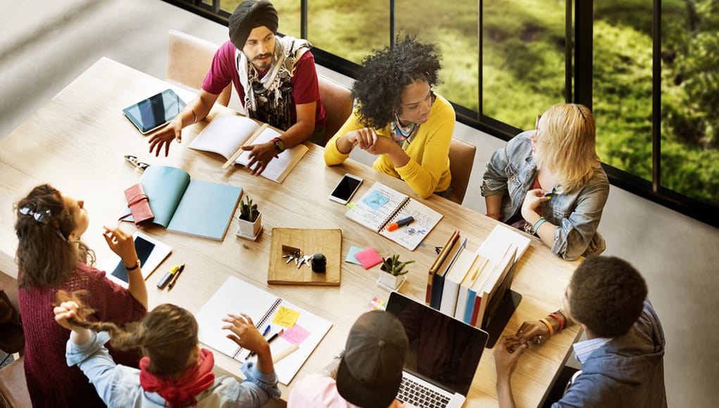 Group of diverse people chatting and developing teamwork, social awareness, and cultural skills Feature Image