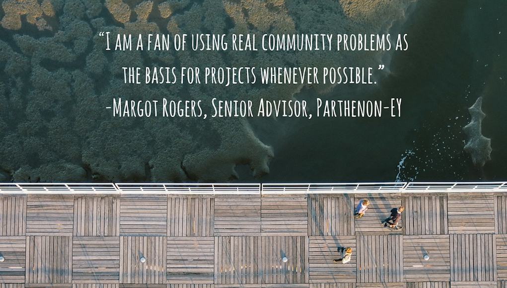 A quote written over a bird's-eye-view-photo of a boardwalk on the ocean saying: "I am a fan of using real community problems as the basis for projects whenever possible