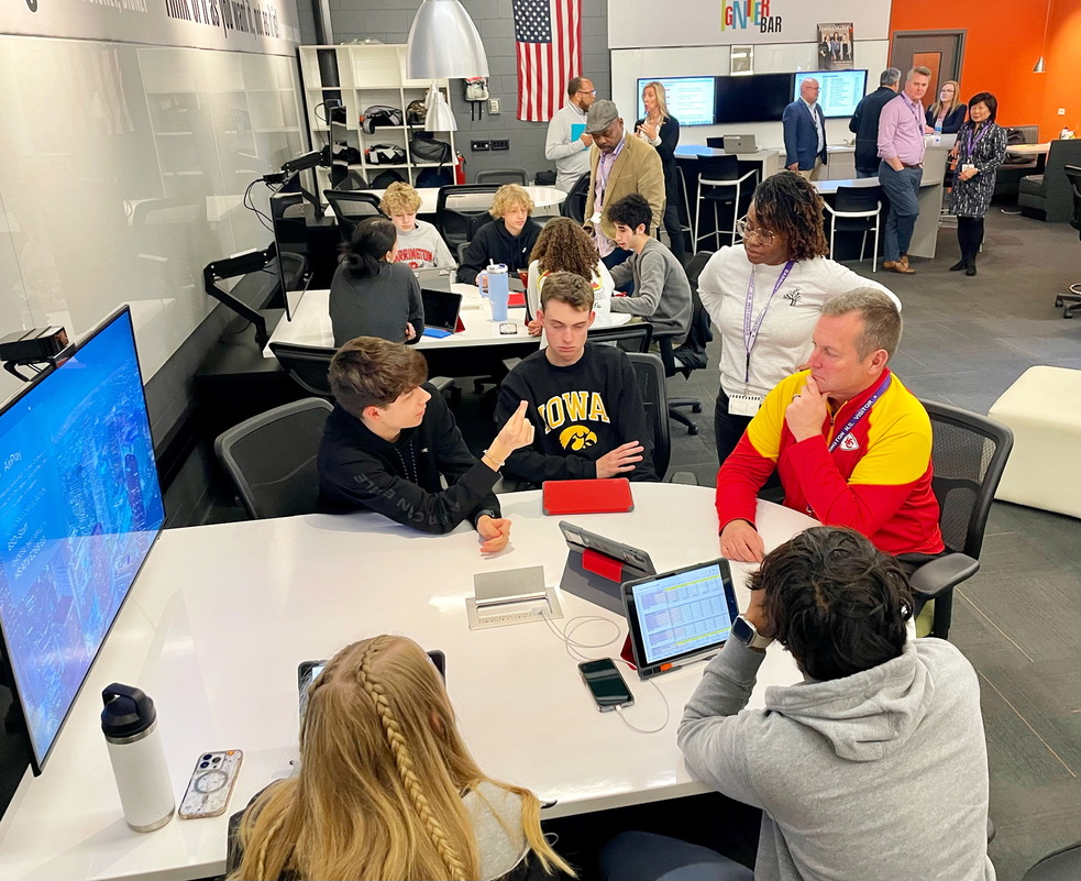 Students and teachers collaborating in a smart, active classroom type of setup at Barrington High's Incubatoredu class