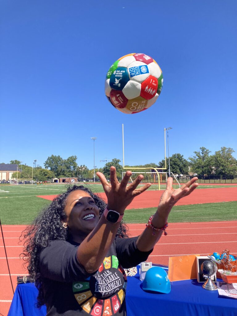 Ms. Nichelle Calhoun, co-leader of SDG alignment in Coolidge’s Redesign, celebrates at the Global Goals Week event in September 2023 (photo courtesy of Abby Quirk) 