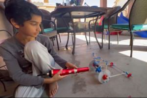 A student works on their pneumatic vs hydraulic efficiency experiment1