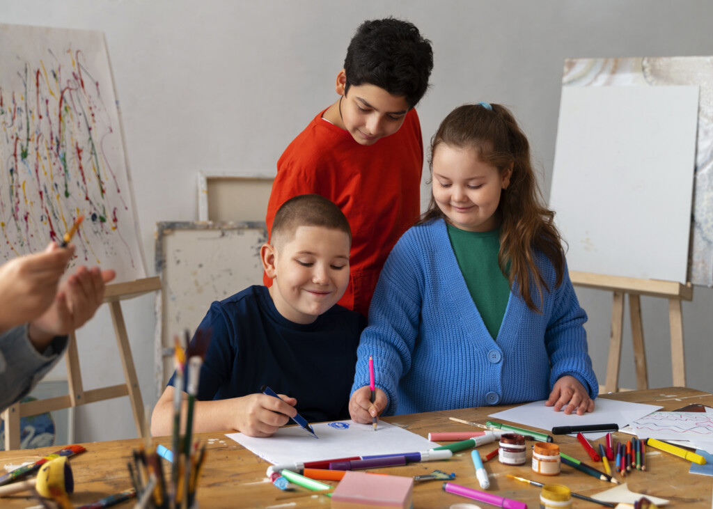 Three children enjoying a coloring project.